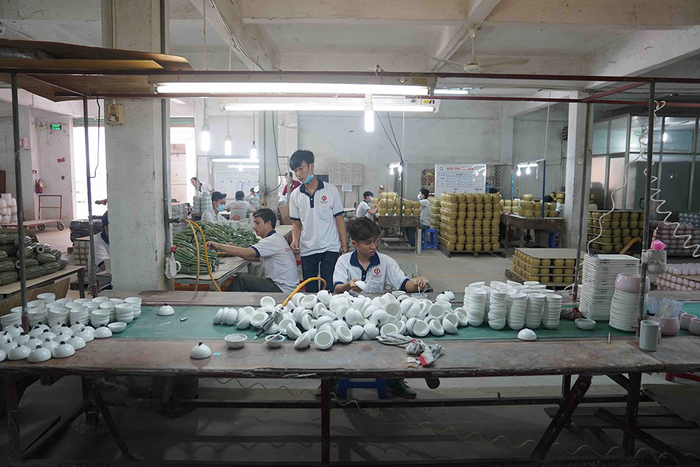 A boy in Vietnam enjoys age-appropriate tasks and working hours at a factory